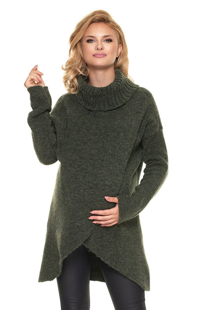 Model wearing the Luxurious Wool Blend Pregnancy Sweater with Turtleneck in rich green, highlighting its chic asymmetrical cut and versatile style for mothers.