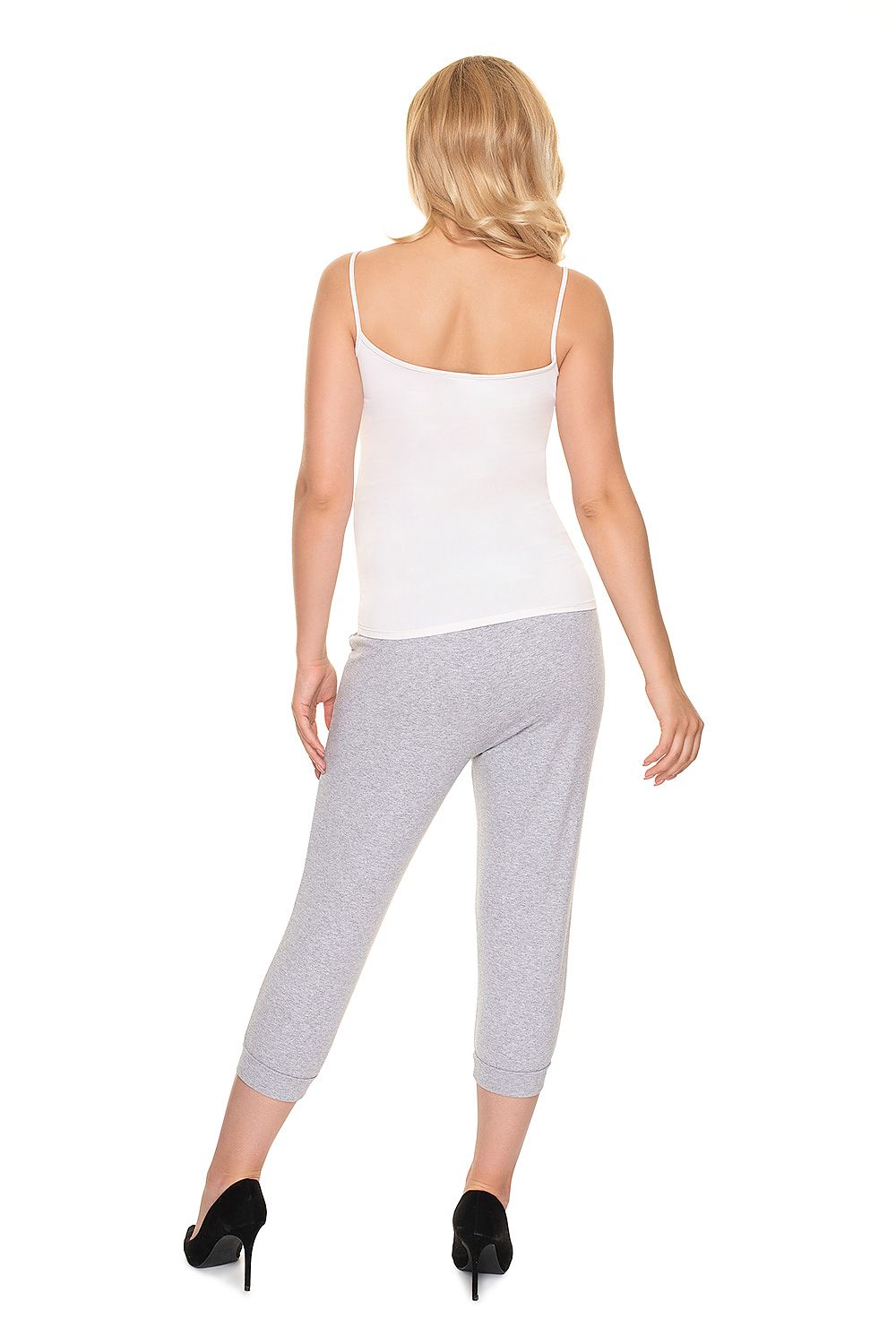 Rear view of a pregnant model in PeeKaBoo Elegant Fit Ribbed Cotton Maternity Crop Pants with Side Pockets, exuding elegance in a white tank top and grey crop trousers.