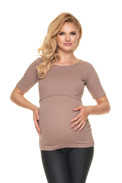 Model wearing the Elegant Pregnancy Blouse with Pleats for Comfortable Nursing by PeeKaBoo Fashion in a soft beige tone. The blouse elegantly complements her pregnancy glow.
