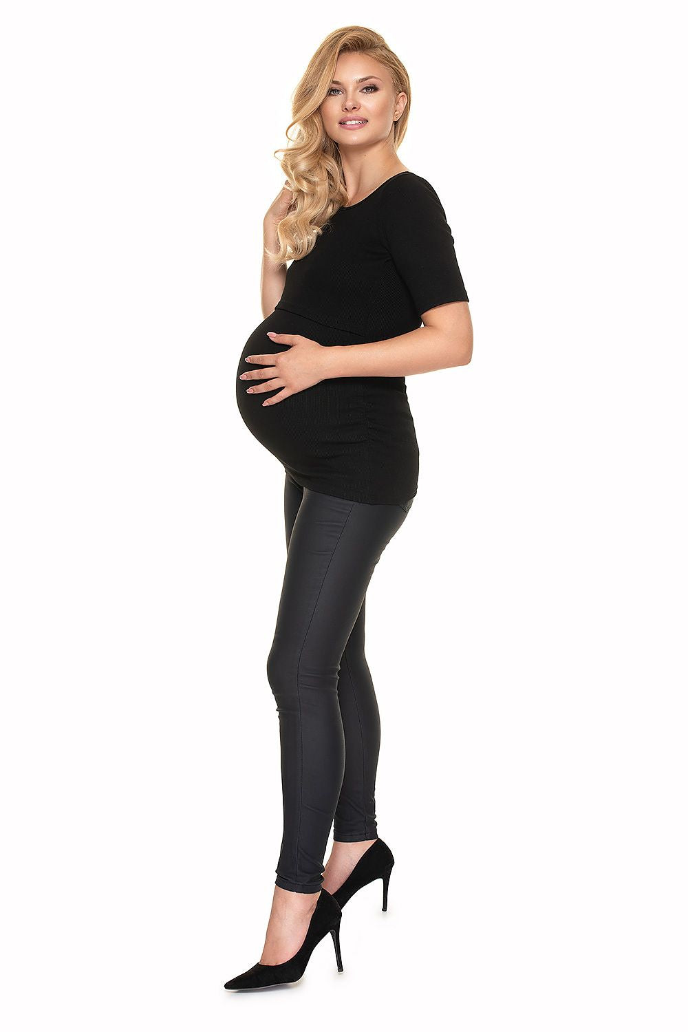 Elegant Pregnancy Blouse with Pleats for Comfortable Nursing by PeeKaBoo Fashion, presenting a side view of a pregnant woman in a stylish black blouse and tailored black leggings, exuding a luxurious look.