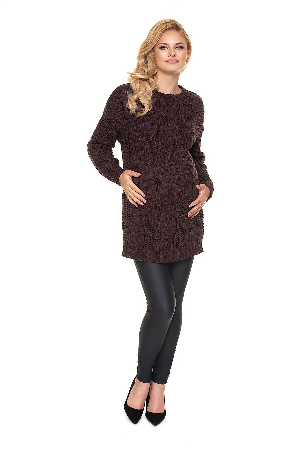 Elegant Pregnancy Sweater by PeeKaBoo, a soft acrylic pullover in deep brown, model exhibiting the stand-up collar and braided motif alongside sleek black leggings for a sophisticated look.