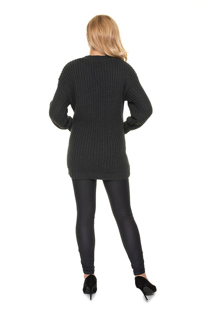 Elegant Pregnancy Sweater by PeeKaBoo - highlighting the back view of a glamorous woman in a soft acrylic pullover with braided motif, complemented by sleek black leggings and stylish heels.