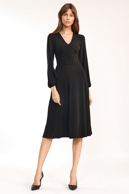 Classic Midi Dress with V Neckline and Long Sleeves by Nife - Chic front pose in a classic black fabric, exuding sophistication suitable for any event.