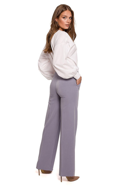 Showing the back of the Elegant Straight Leg Trousers by Makover in light grey, complemented by a white blouse, ideal for sophisticated business attire.