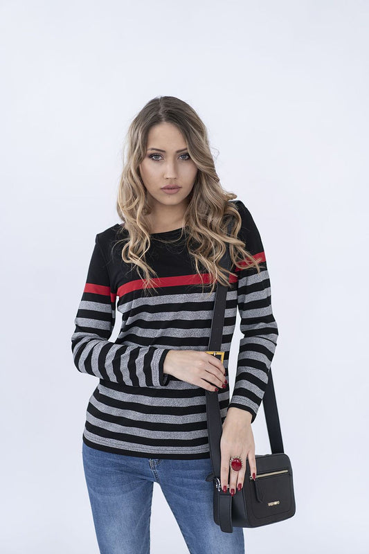 Stylish model wearing a luxurious Hajdan long-sleeved black and grey striped blouse, showcasing modern elegance and versatility, perfect for everyday wear.