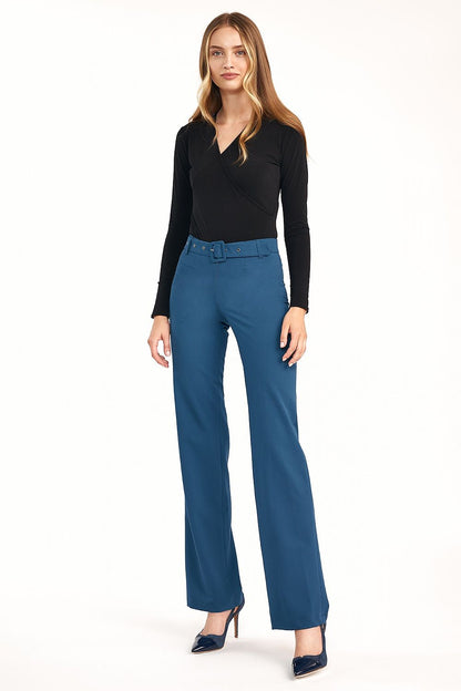 Elegant women’s flared trousers with elevated waist by Nife, showcased in a vibrant blue ensemble with a chic black wrap top, exuding modern elegance.