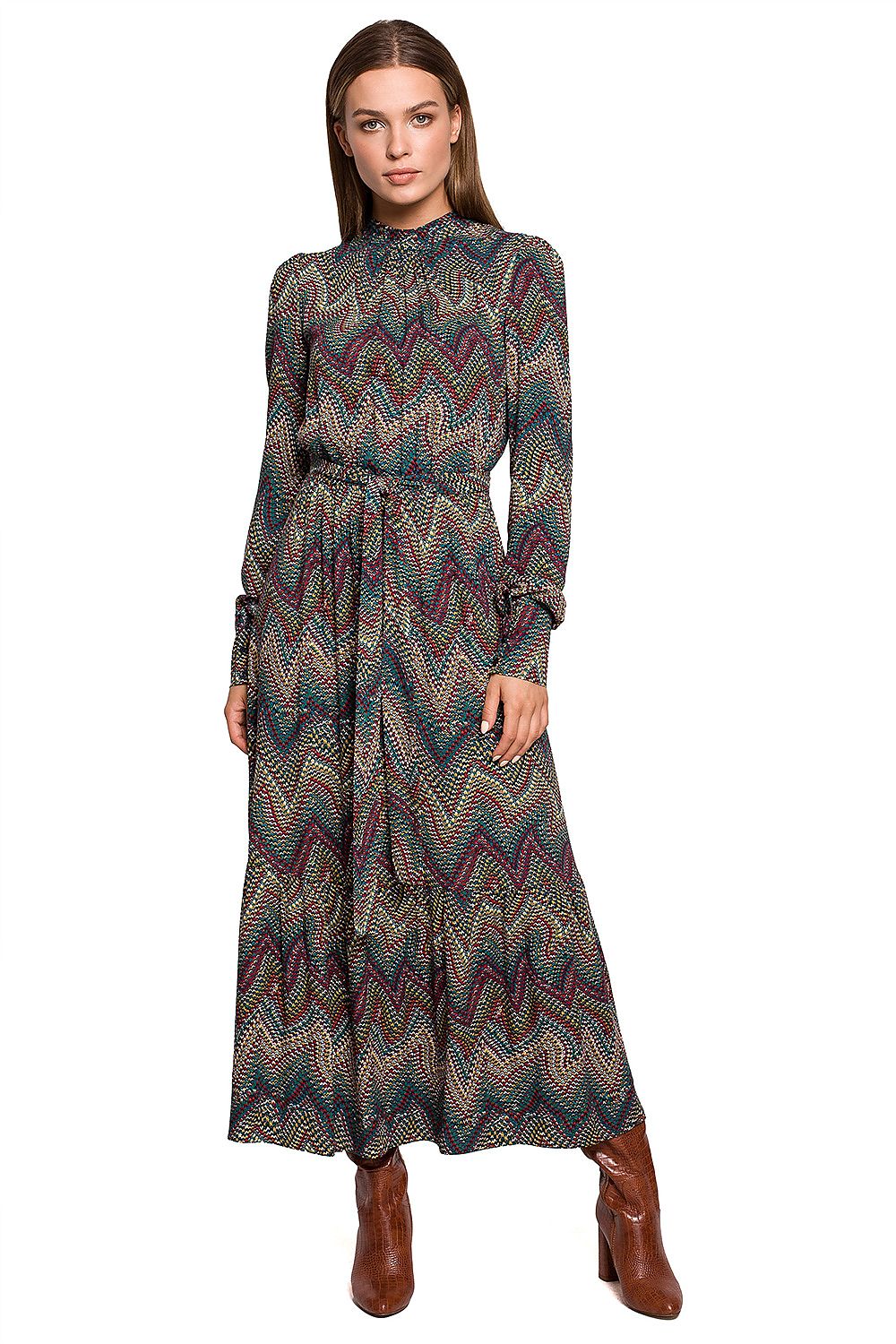 Stylove Aztec Pattern Daydress featuring a ruffle hem and stand-up collar, elegantly styled for autumn. Model showcases the dress with a chic ankle boot ensemble.