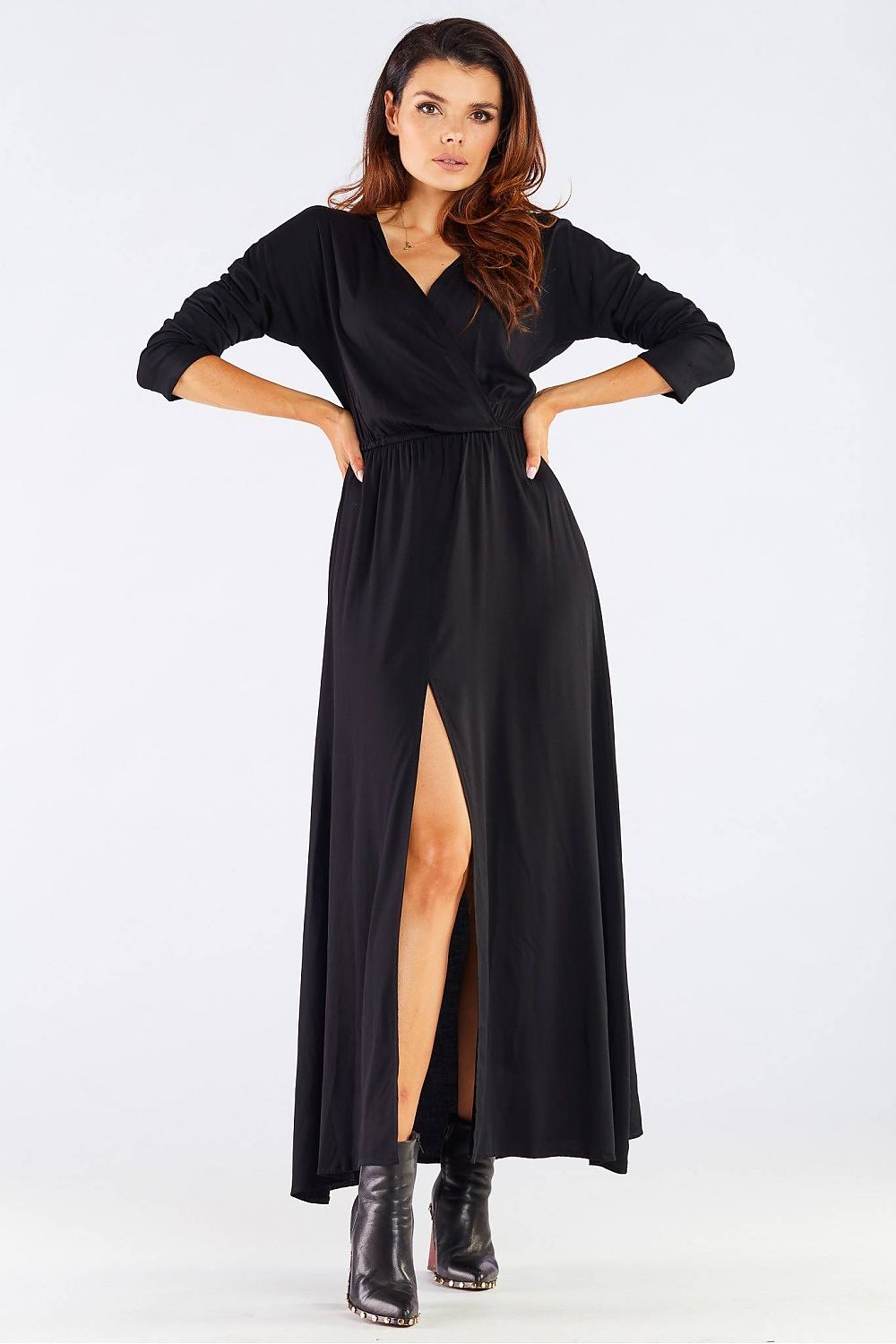 Elegant Long Sleeve Daydress in Viscose with Zip Detail - Perfect for Colder Days, illustrated by a model in a stunning black dress featuring a front view highlighting its feminine silhouette and stylish slit.