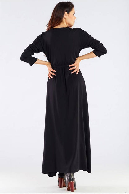 Elegant Long Sleeve Daydress in Viscose with Zip Detail - Perfect for Colder Days, featuring the back view of the model wearing a classic black dress, underscoring its timeless appeal and luxurious fabric.