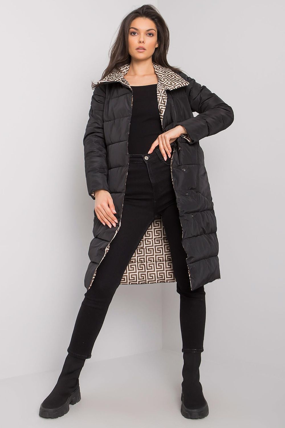 Luxury black quilted winter coat for women by Yups, featuring insulated lining and elegant zip fastening.