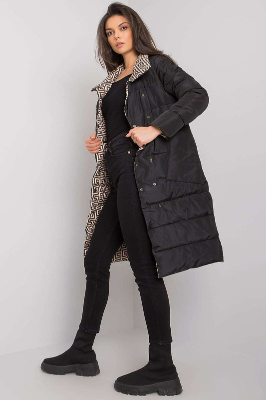 Side view of the luxurious Yups black quilted winter coat, showcasing its stylish design and functional slide pockets.
