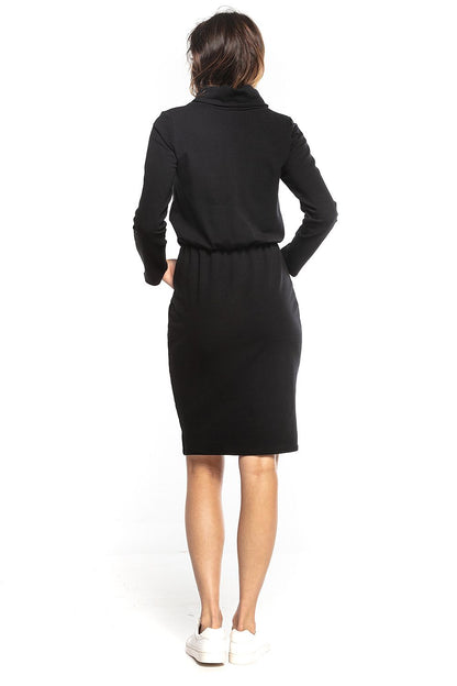 Back view of the Tessita Sporty Midi Dress in sleek black, highlighting the comfortable design with a cinched waist and long sleeves.