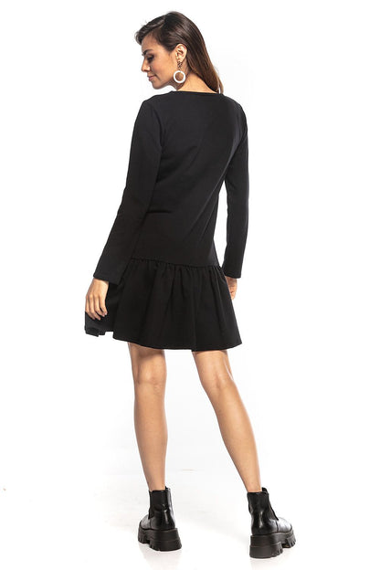 Elegant black sporty midi dress by Tessita featuring a loose fit, long sleeves, and a chic frill hem, perfect for stylish casual outings.