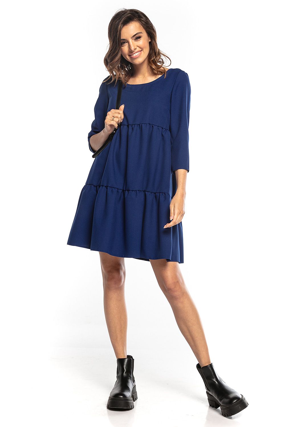Stylish navy blue mini dress featuring 3/4 sleeves and a flared silhouette, crafted by Tessita. The deep back neckline enhances its elegance for any occasion.