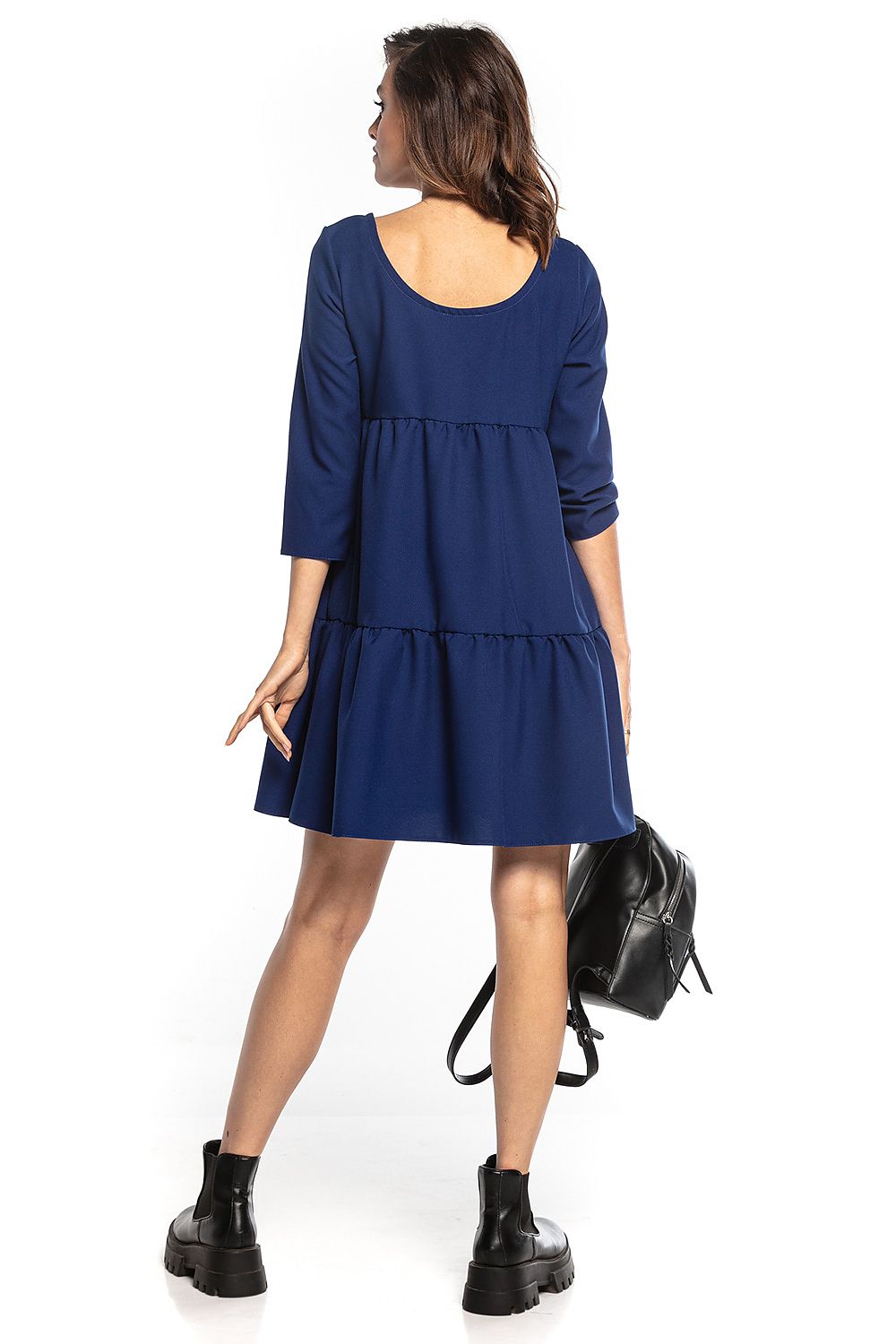 Sophisticated navy mini dress with a flared cut and 3/4 sleeves by Tessita. The design features a deep back neckline, merging luxury with comfort.