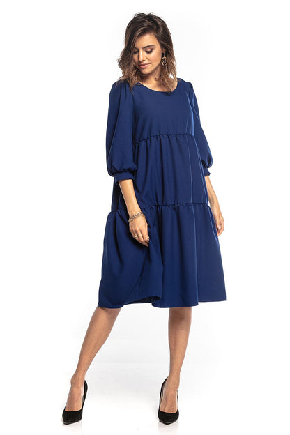 Sophisticated navy blue bouffant sleeve day dress with signature ruffles by Tessita, embodying effortless elegance.