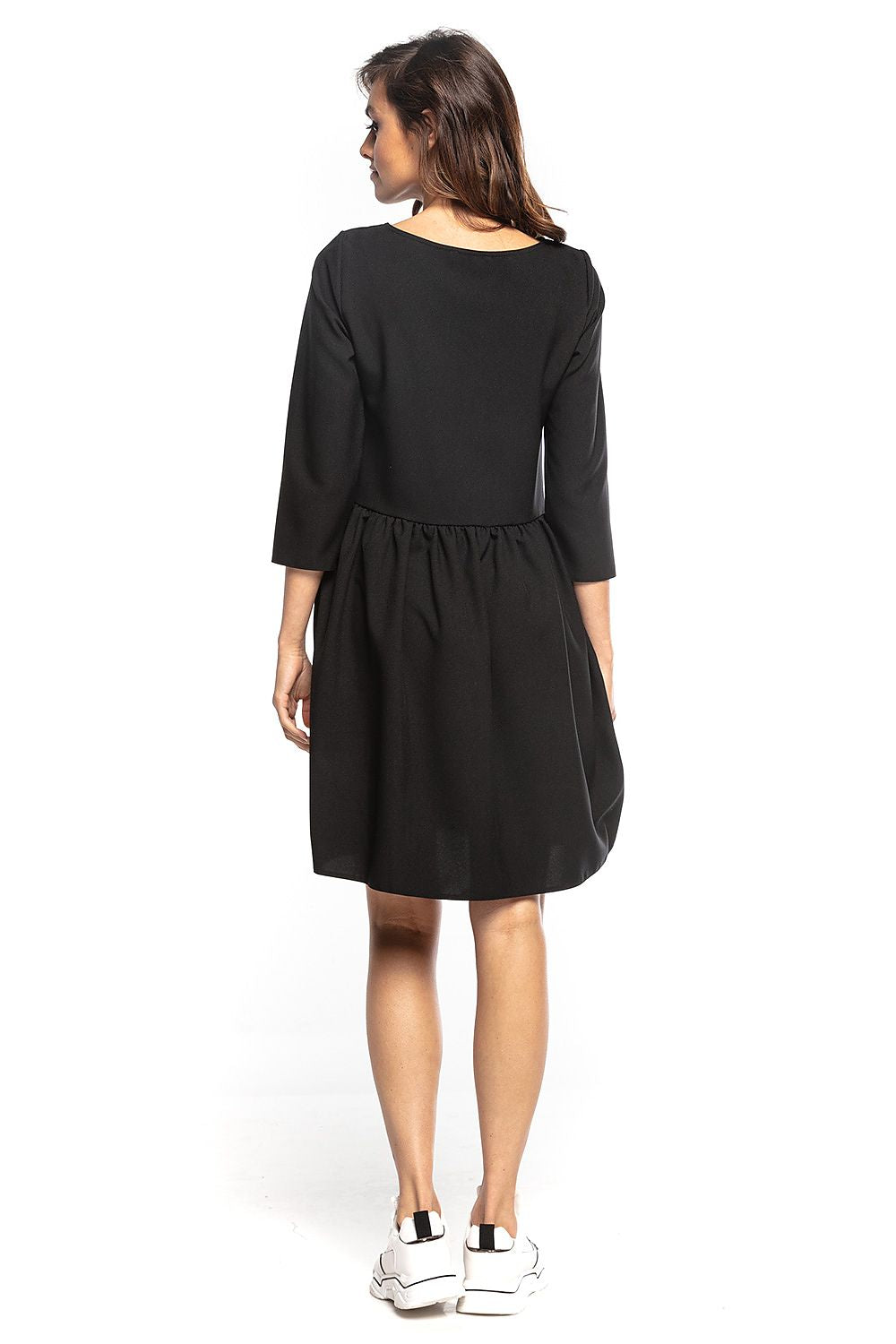 Back view of a sophisticated black midi dress by Tessita, featuring 3/4 sleeves and elegantly flared bottom, ideal for refined events.