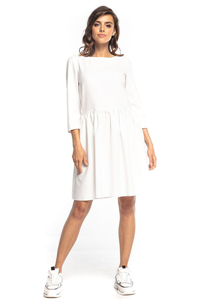 Stunning white midi dress by Tessita, designed with 3/4 sleeves and graceful waist pleats, embodying a luxurious style for any occasion.