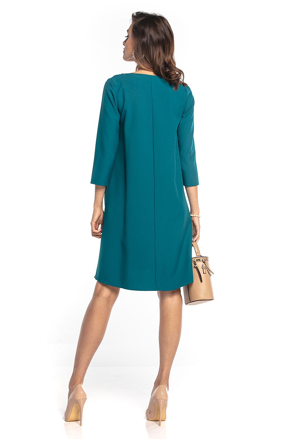 Back view of the luxurious Tessita trapeze dress in teal, showcasing the refined design and flattering silhouette.