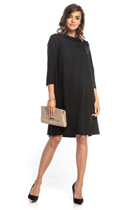 Chic black trapeze midi dress with 3/4 sleeves and a Jackie Kennedy style collar by Tessita. Ideal for a stylish yet elegant look.