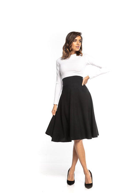 Tessita high-waisted black midi skirt elegantly styled with a fitted white long-sleeve top, showcasing a flattering silhouette for sophisticated fashion.