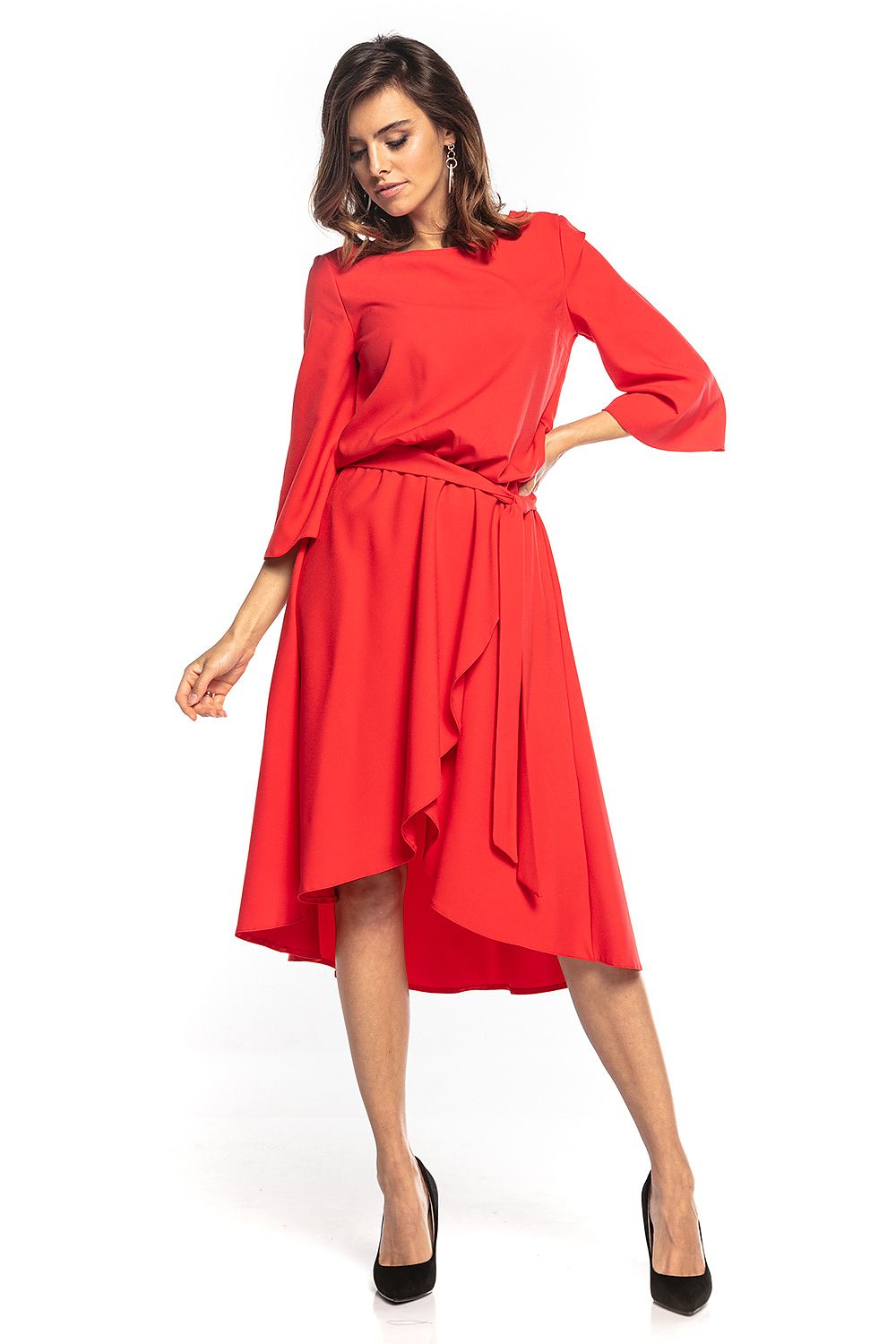 Elegant asymmetrical midi dress by Tessita featuring 3/4 sleeves, a belted waist, and a longer back design. Perfect for sophisticated outings, showcased in a striking red hue.