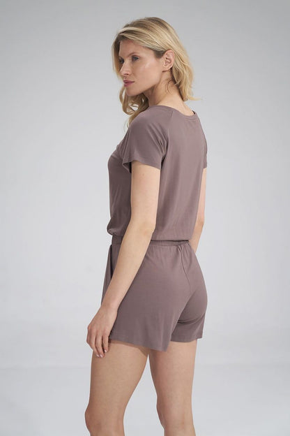 Back view of a sophisticated summer jumpsuit in taupe, designed with short sleeves and an elastic waistband for a flattering fit.