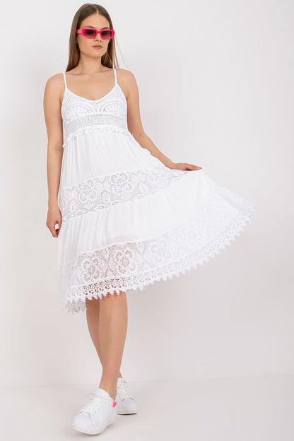 Elegant Och Bella Women's Summer Flared Dress in white, featuring intricate lace details and a heart neckline, styled with trendy pink sunglasses.