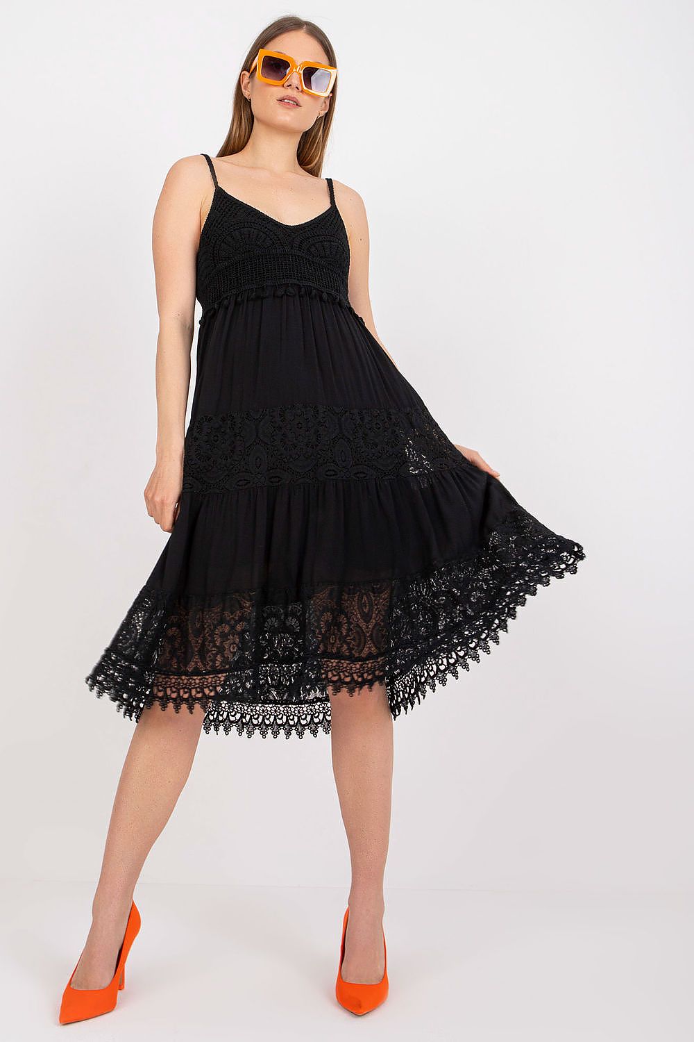 Chic Och Bella Women's Summer Flared Dress in black, adorned with decorative lace and a beautiful heart neckline, complemented by fashionable orange high heels.