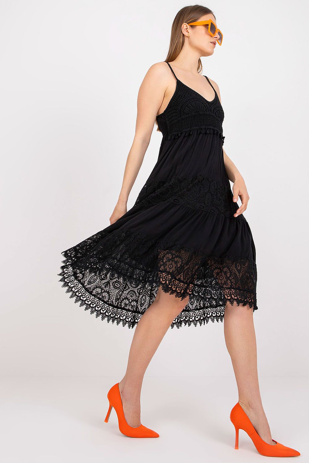 Stylish black Och Bella Women's Summer Flared Dress, showcasing delicate lace patterns and a flattering heart neckline, paired with vibrant orange heels.