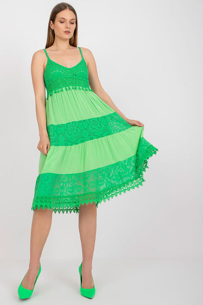 Vibrant green Och Bella Women's Summer Flared Dress, beautifully crafted with lace accents and a heart neckline, styled with matching green heels for a striking look.