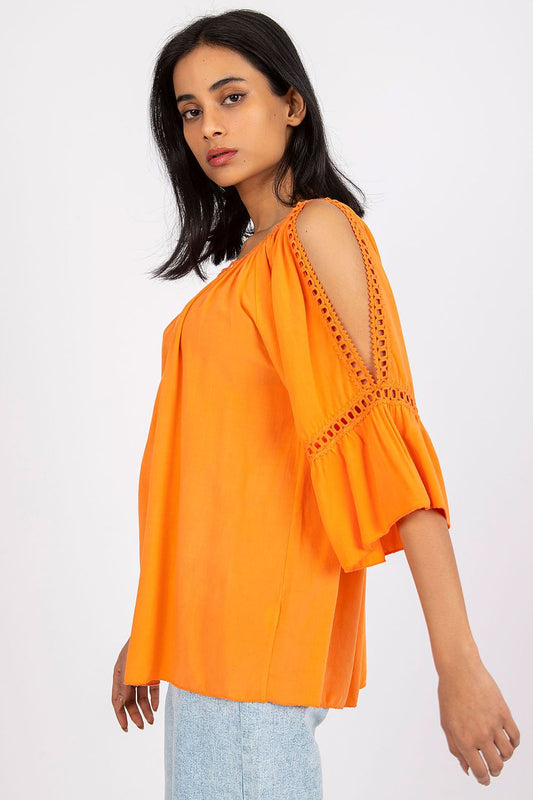 Sophisticated side view of a vibrant ochre loose-fit blouse with 3/4 sleeves, showcasing intricate slit detailing for added elegance.