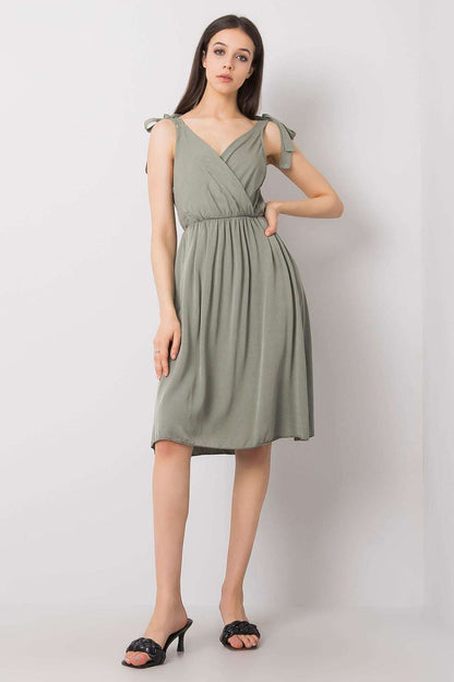Elegant Och Bella sleeveless viscose daydress in soft green, featuring an envelope neckline and delicate tie straps, perfect for summer occasions.