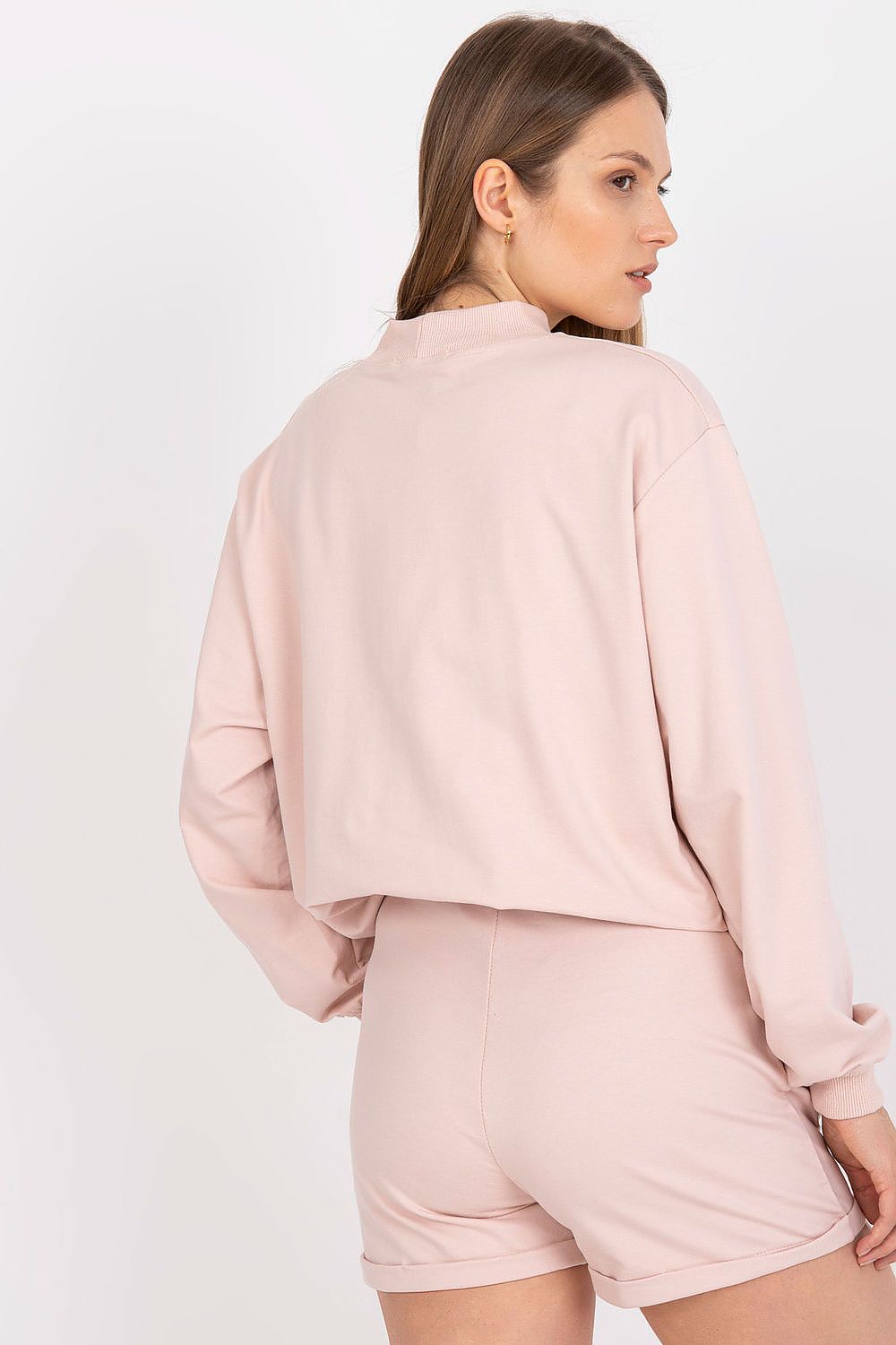 Back view of BFG Men's Luxury Cotton Sweatshorts in luxurious pink fabric, styled with a crop top, ideal for relaxed summer outings.