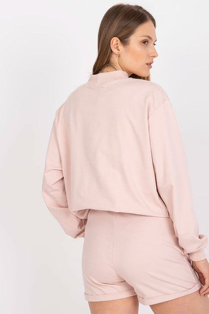 Back view of BFG Men's Luxury Cotton Sweatshorts in luxurious pink fabric, styled with a crop top, ideal for relaxed summer outings.