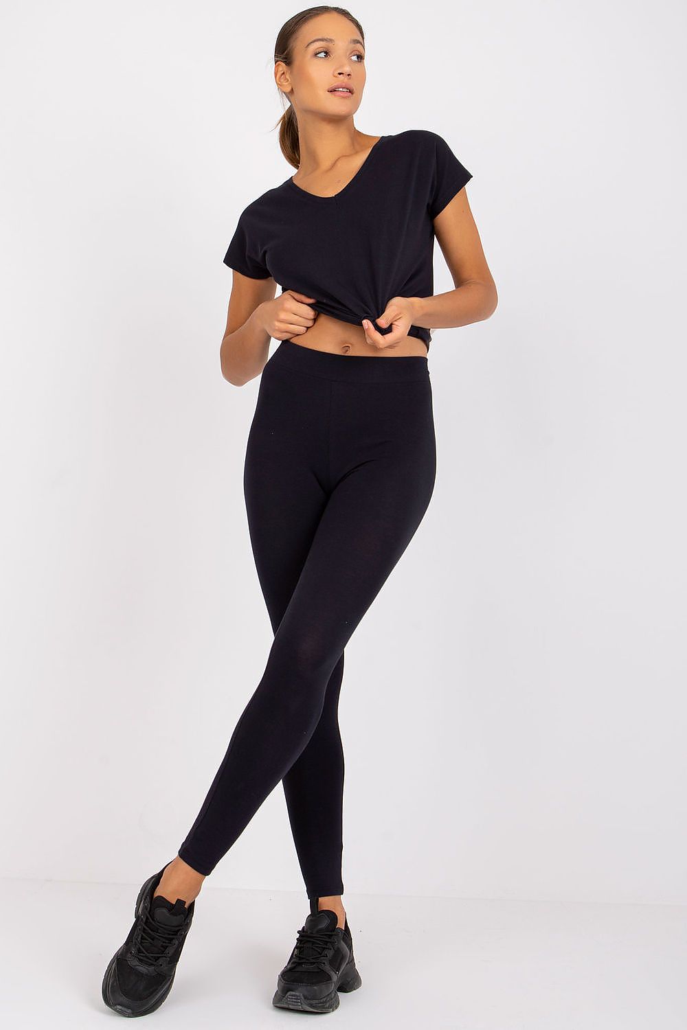 BFG luxury cotton-spandex leggings in classic black, complemented by a casual black t-shirt, representing an elegant and comfortable fashion choice.