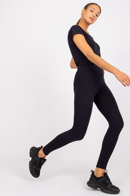 Model showcasing BFG luxury black cotton-spandex leggings, exuding elegance and style in a dynamic pose.