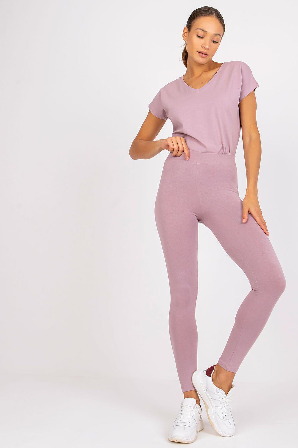 Elegant model showcasing BFG Luxury Cotton-Spandex Leggings in soft lilac, paired with a matching short-sleeve top, exuding comfort and style.