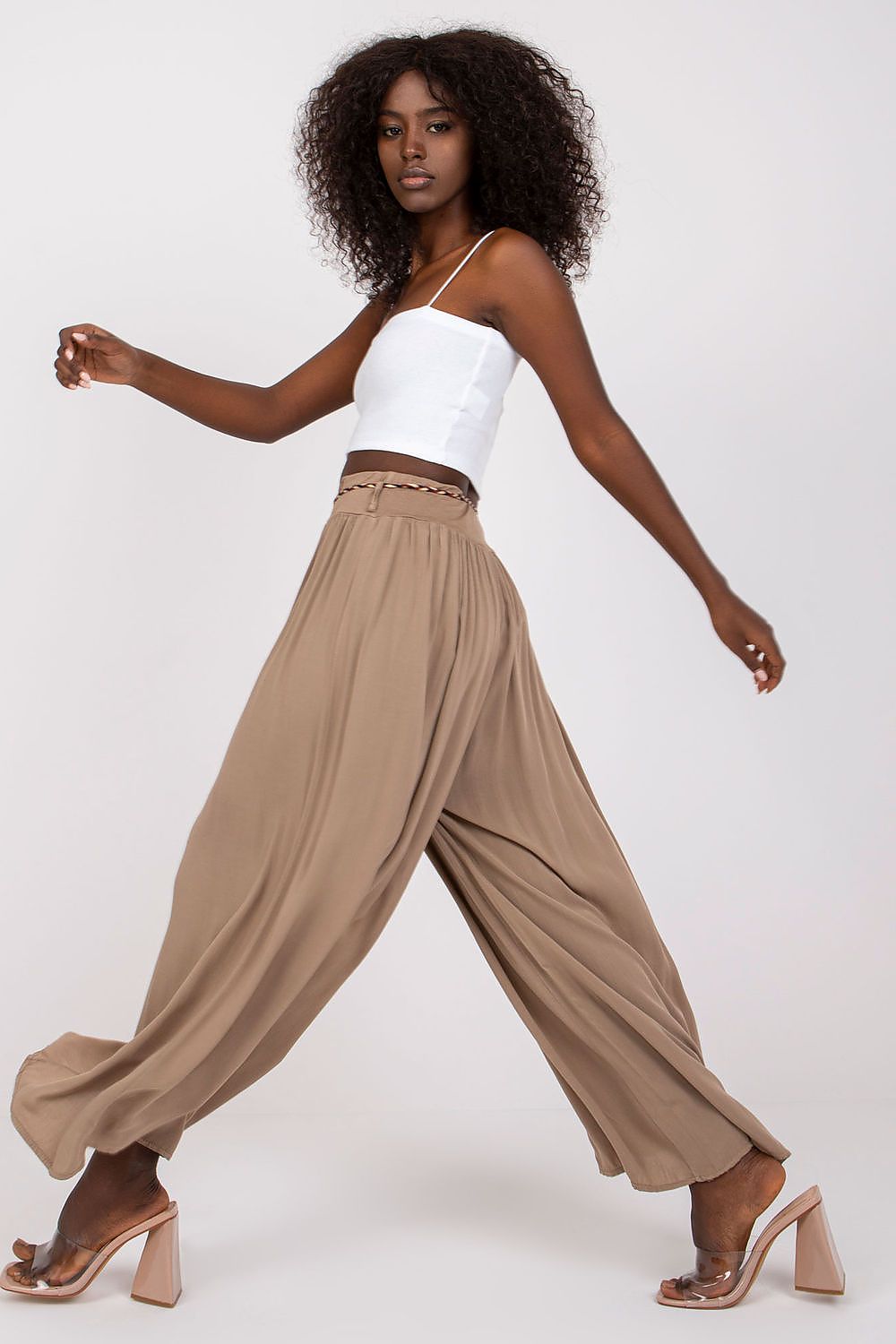 Model wearing Och Bella High-Waisted Viscose Trousers with Wide Legs and Decorative Tie Belt, showcasing a chic and effortless style, highlighted by a flowing silhouette and elegant tie belt, ideal for luxurious summer fashion.