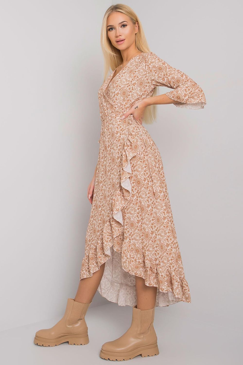 Elegant Och Bella Summer Dress with 3/4 Sleeves, Ruffle Details, and Waist Tie, model highlighting the intricate detailing and chic flow of the dress from a side angle.