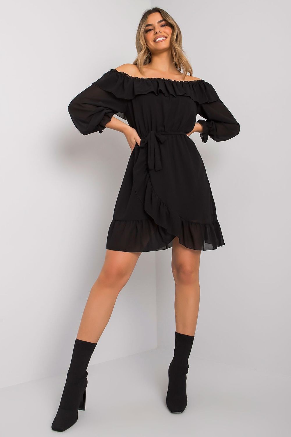 Och Bella Spanish Style Daydress with Long Sleeves, Decorative Frills & Waist Tie, showcased by a model in a stylish pose, highlighting its elegant design and flattering fit.