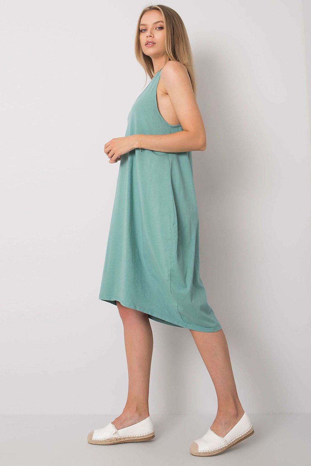 Side view of the Och Bella Sleeveless Cotton Spandex Daydress in a refreshing mint colour, highlighting its elegant design and relaxed fit, ideal for summer elegance.