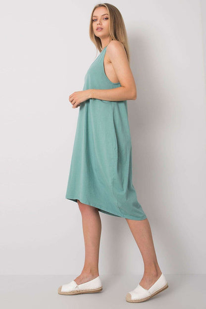Side view of the Och Bella Sleeveless Cotton Spandex Daydress in a refreshing mint colour, highlighting its elegant design and relaxed fit, ideal for summer elegance.