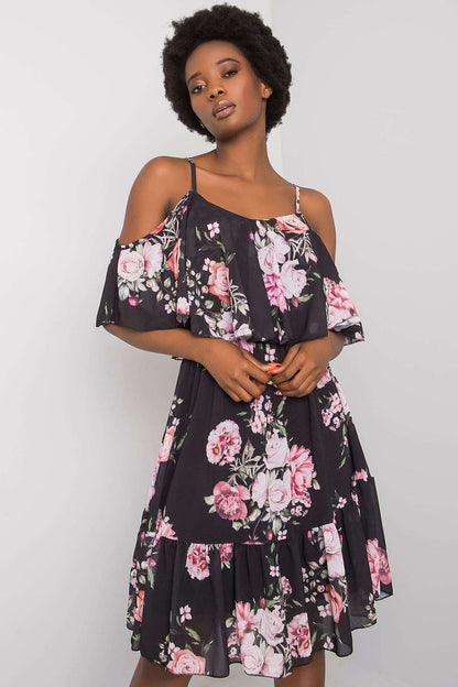 Model showcasing the Och Bella Floral Strapless Daydress with Frill - Elegant Flared Cut, perfect for any occasion. The dress features a striking floral design with short sleeves and a flared silhouette, ideal for both casual and formal settings.