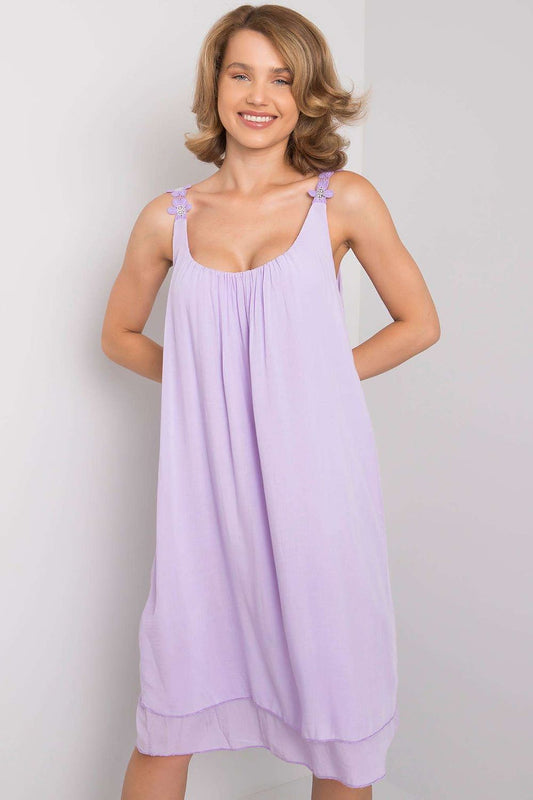 Elegantly Designed Summer Dress With Decorative Straps by Och Bella, model wearing a stylish lavender dress with decorative straps, showcasing a loose cut, perfect for summer occasions.