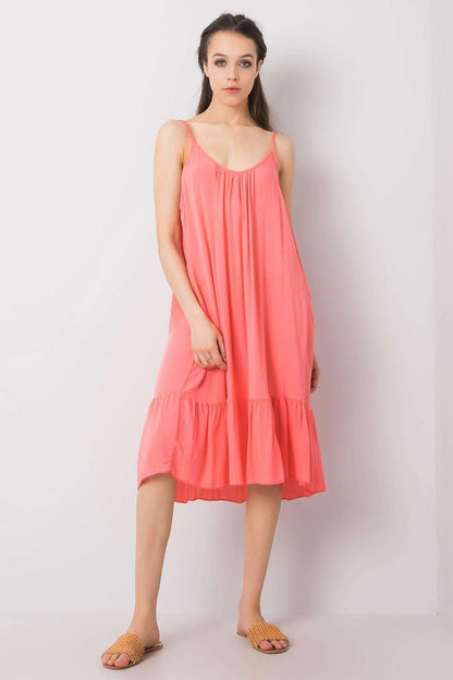 Stylish strapless flared daydress with frill by Och Bella, showcasing summer elegance in vibrant coral, perfect for sunny outings.