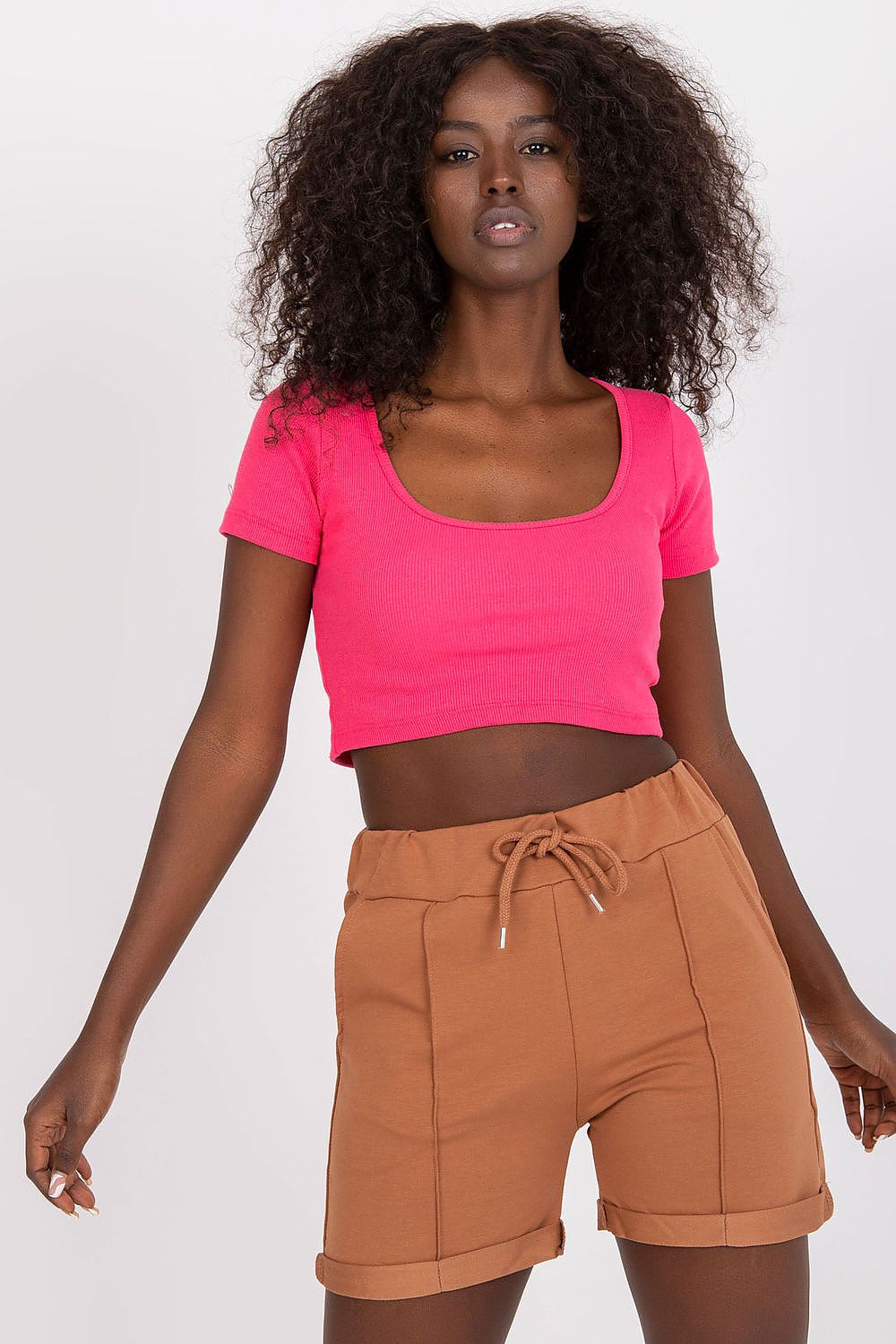 Luxury Cotton High-Waisted Shorts with Tie Waist and Pockets featured on a model in a chic pink cropped top, showcasing the elegant fit and design.