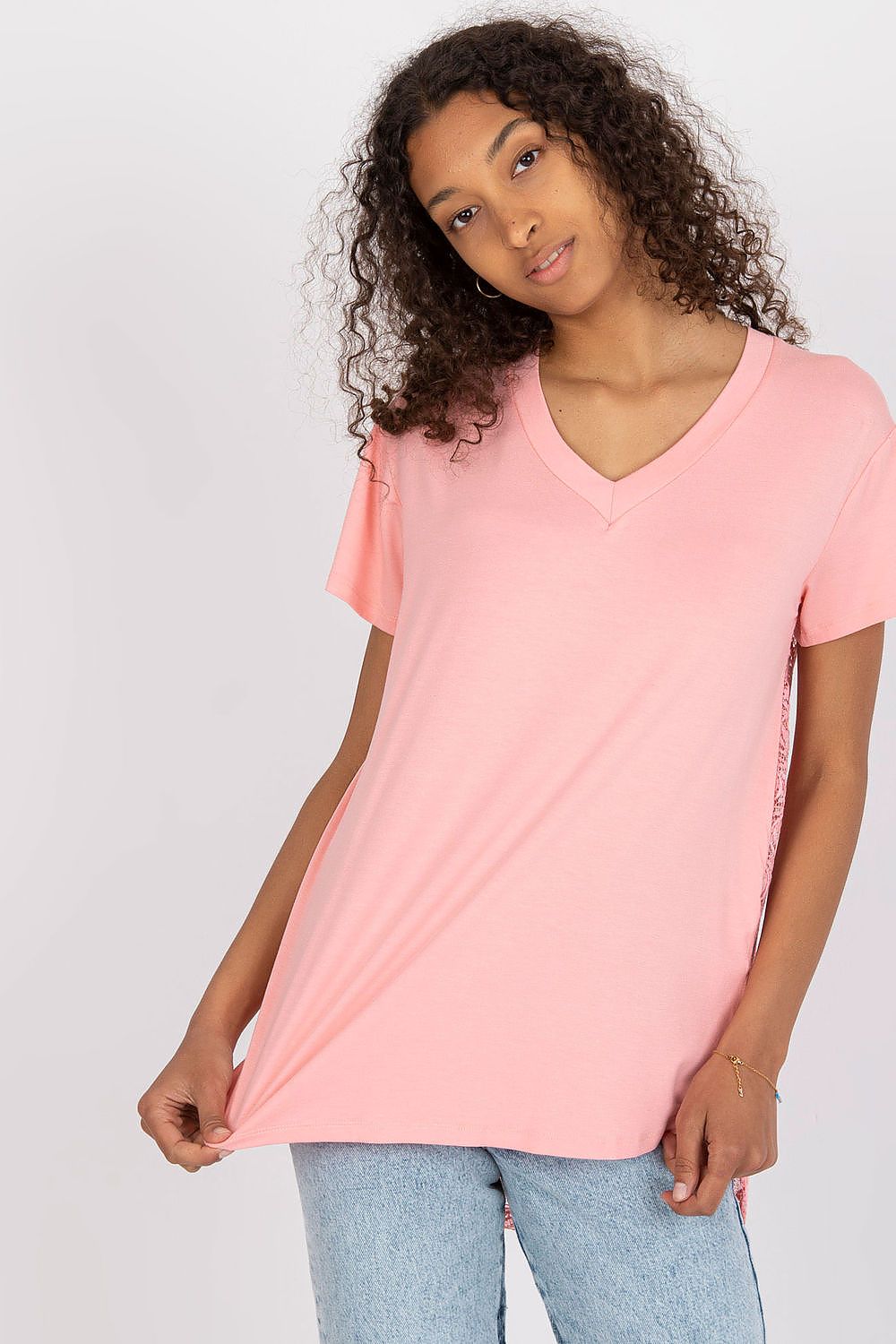 Elegant Short Sleeve Blouse with Lace Back and Cheese Neckline - EU 0 modelled by a woman in soft pink, showcasing its elegantly designed cheese neckline and delicate lace accents at the back.