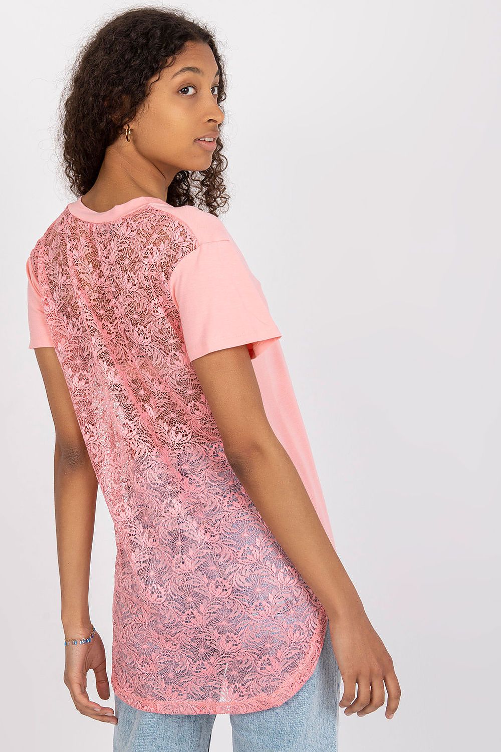 Elegant short sleeve blouse with lace back and cheese neckline, featuring a model showcasing the delightful lace detail at the back of the garment, highlighting its luxurious design.