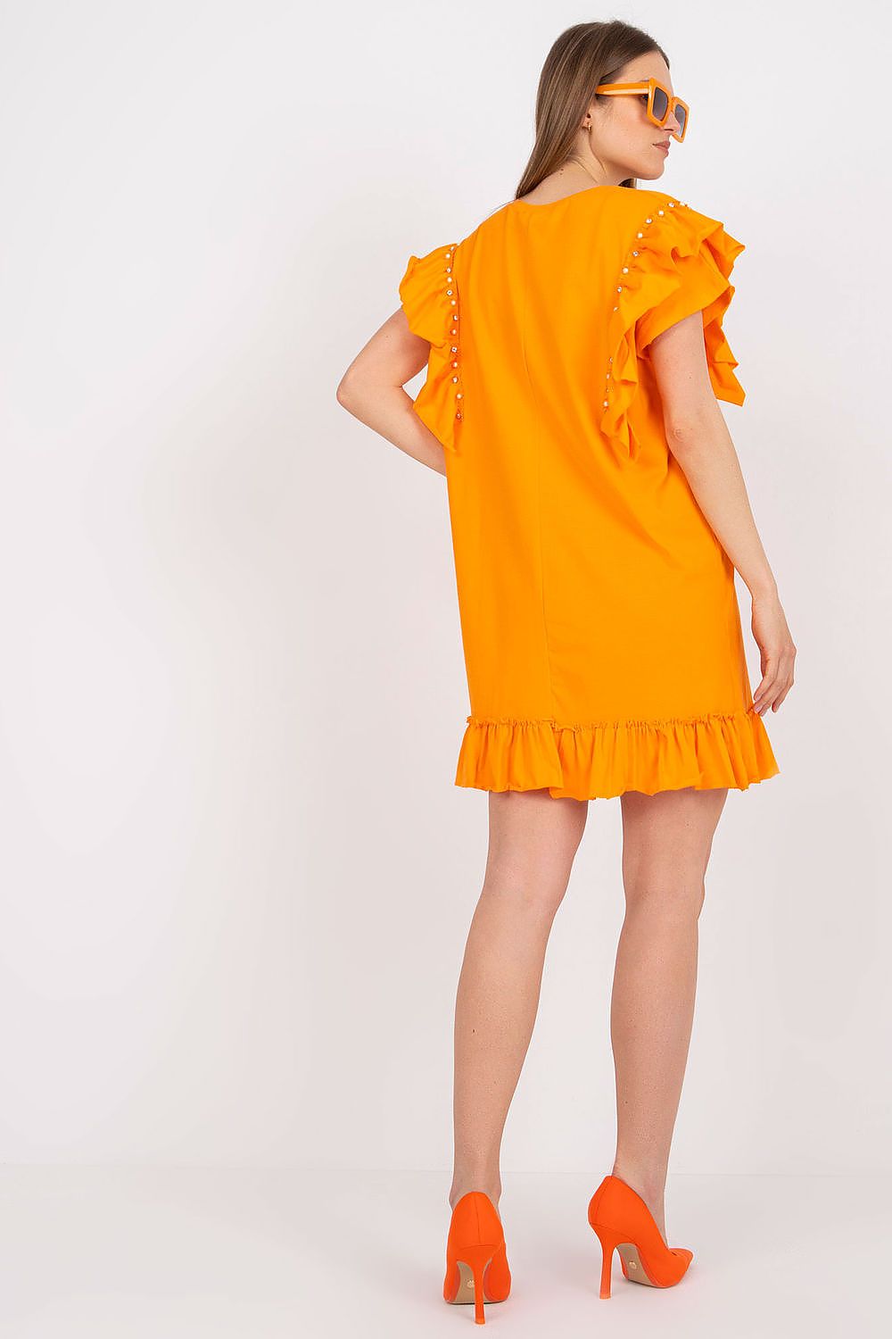 Rear view of the Elegant Straight Cut Daydress with Frills and Zircons in orange, showcasing its luxurious cotton and spandex blend, ideal for versatile styling.